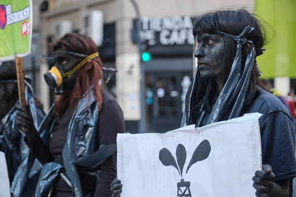 Buenos Aires, Argentina; Sept 24, 2021: Global Climate Strike, young activists dressed and made up in black protesting against oil companies