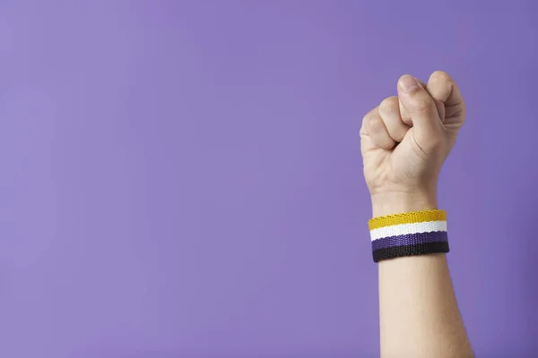 Raised Fist Young Person Wearing Non Binary Flag Bracelet Concepts — Foto de Stock