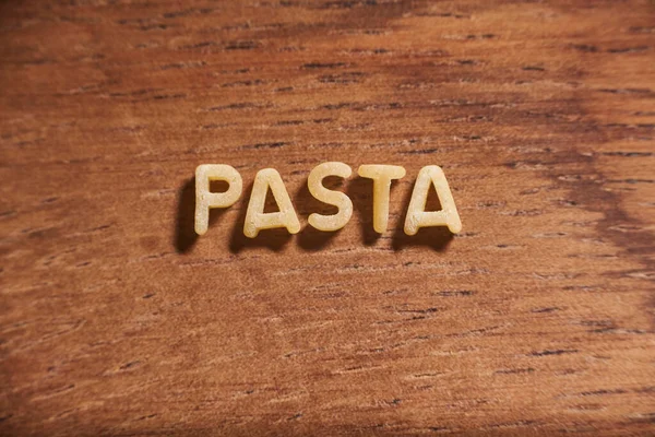 Palabra Pasta Formada Con Letras Pasta Sopa Alfabeto Sobre Fondo — Foto de Stock