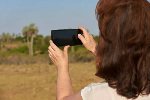 Unrecognizable Woman Taking Photo Her Phone Palmar National Park Entre — ストック写真