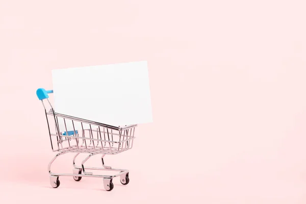 Shopping Cart Blank White Paper Card Pastel Pink Background Minimalist — Stock fotografie