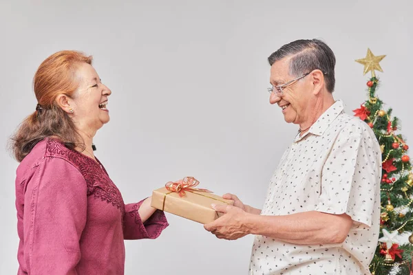 Senior Hispanic Couple Happily Spending Holidays Home One Hands Other — Stock Photo, Image