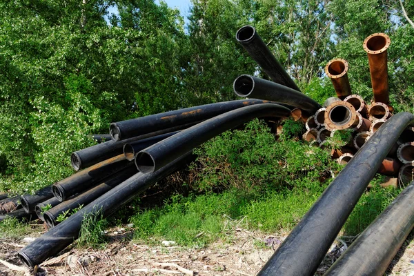 Large pipes running into the lake — Stock Photo, Image