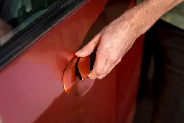 Hand of a man opening car door — Stock Photo, Image