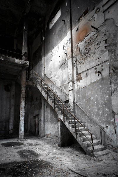 Abandoned industrial interior with stair