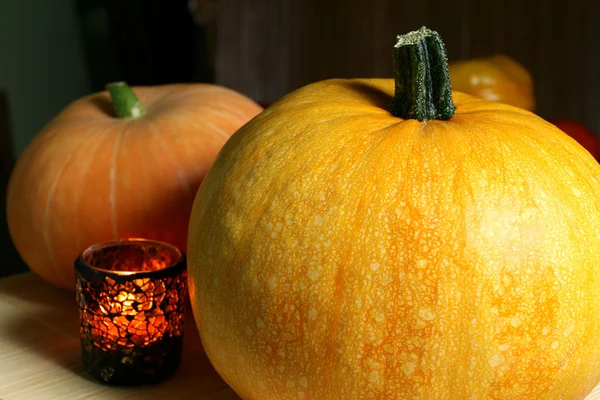Pumpkins and candle — Stock Photo, Image