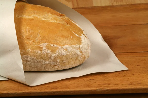 Baked bread in paper — Stock Photo, Image