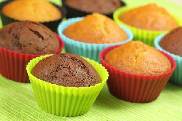 Muffins in colorful moulds — Stock Photo, Image