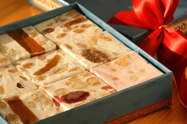 Sweet nougat bars in box — Stock Photo, Image