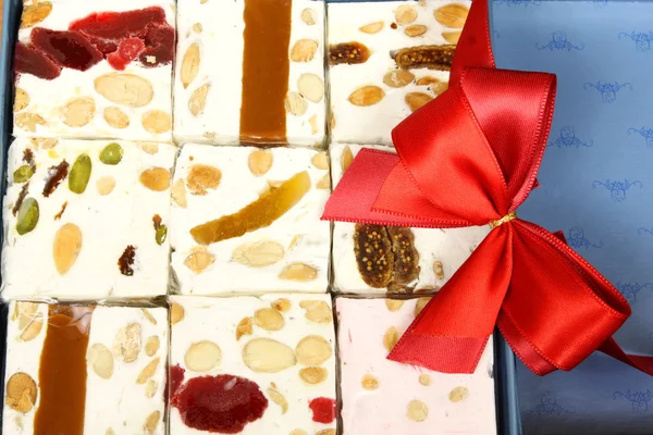 Sweet nougat bars in box — Stock Photo, Image