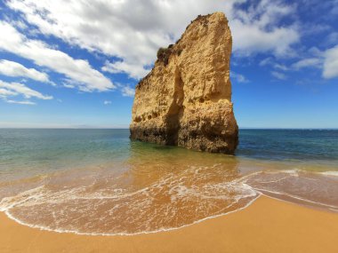 Algarve beach cliff rock in Portugal. Scenic Atlantic Ocean view.