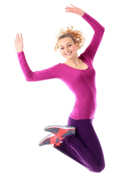 Fitness-Frau springt aufgeregt isoliert auf weißem Hintergrund. lizenzfreie Stockfotos