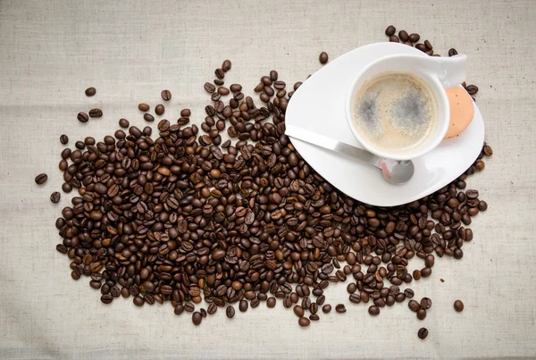 Hot coffee with beans — Stock Photo, Image