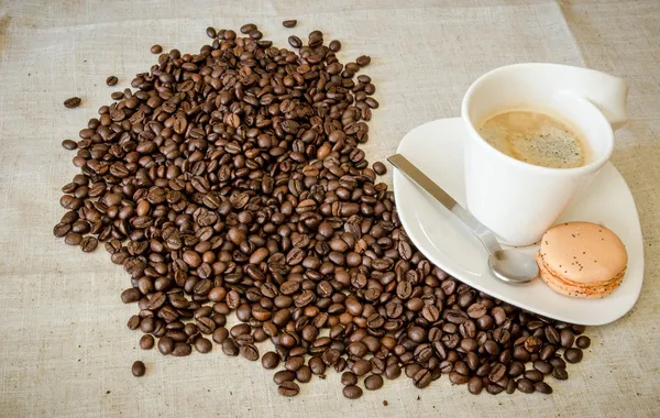 Hot coffee with beans — Stock Photo, Image