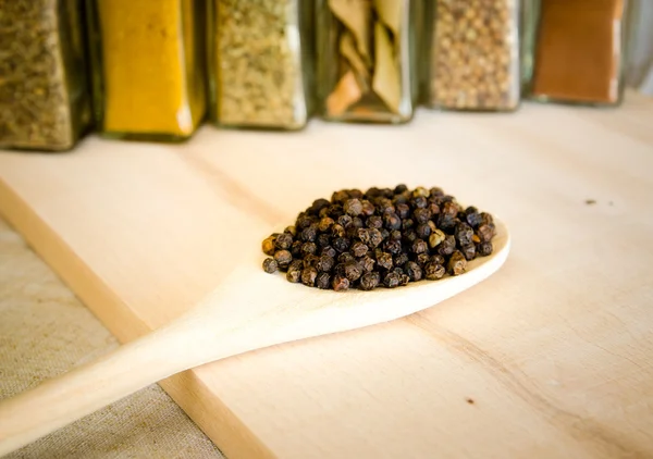 Herbs and spices on wood — Stock Photo, Image