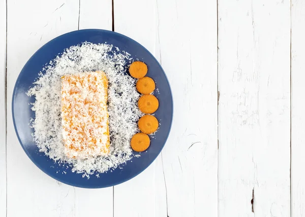 Carrot and coconut cake on white table — Stock Photo, Image