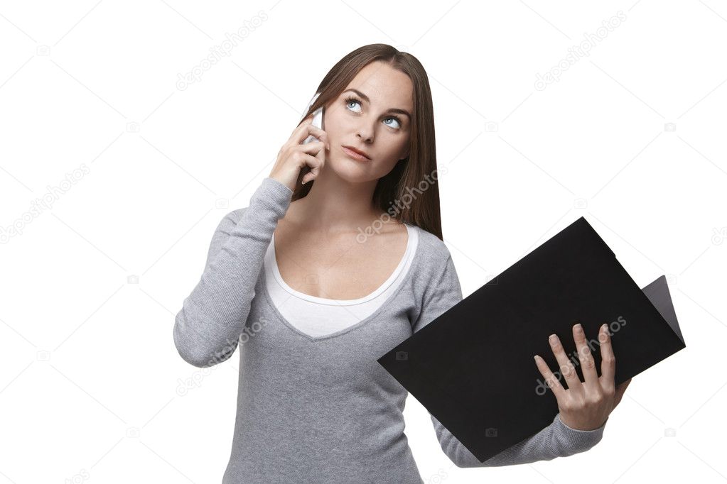 Woman with folder and mobile phone looking up