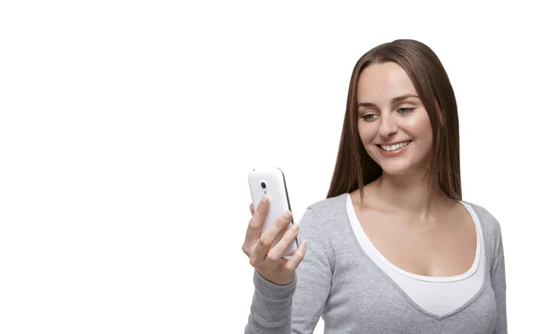 Woman looking at her mobile phone — Stock Photo, Image