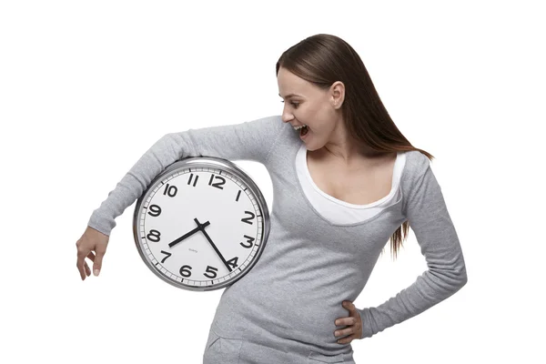 Woman looks at the clock — Stock Photo, Image