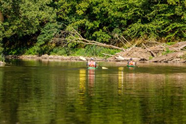 Canoeing and kayaking on the werra river at wartha in germany, July 31, 2022