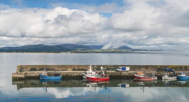 Helvic, Ireland - 18 August, 2022: colorful fishing boats on the docks in the harbor of Helvic in County Waerford