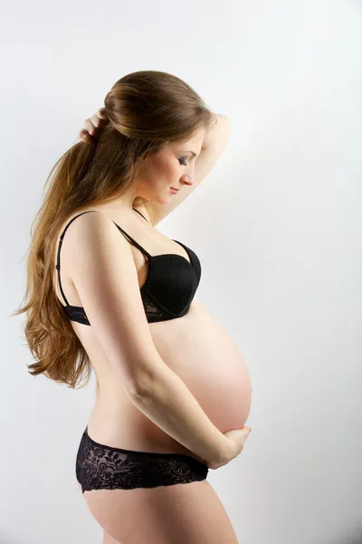 Mujer embarazada joven Fotos De Stock Sin Royalties Gratis