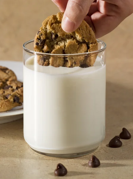 Cookies being dunked — Stock Photo, Image