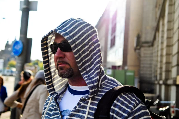 Middle age traveling man wearing hood — Stock Photo, Image