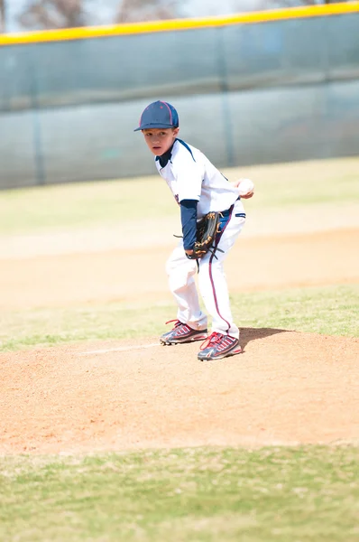 Youth baseball pitcher looking. — Stock Photo, Image