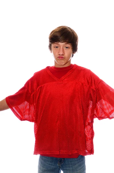 Young teen boy in red jersey isolated on white — Stock Photo, Image