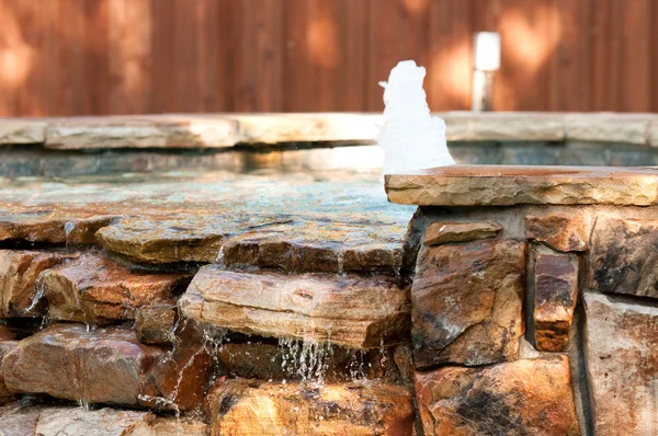 Pool spa with waterfall and fountain — Stock Photo, Image