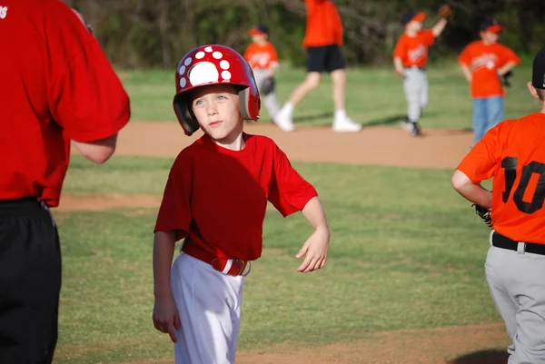 Cute baseball little league player Stock Picture