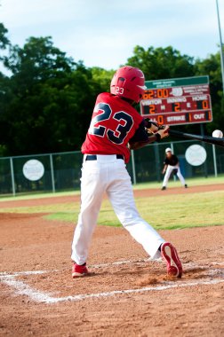 Little league boy at bat clipart