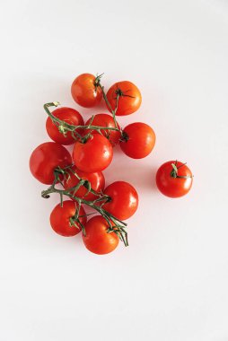 Fresh raw cherry tomatoes on white table. Top view