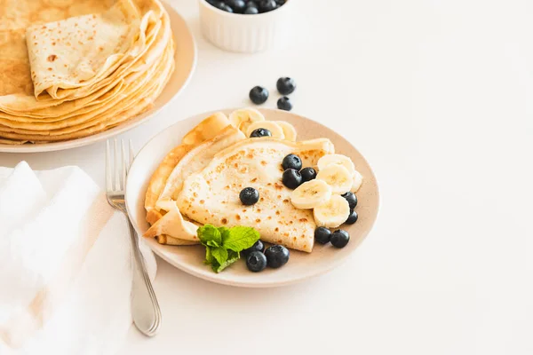French Crepes Banana Blueberries White Table — стоковое фото