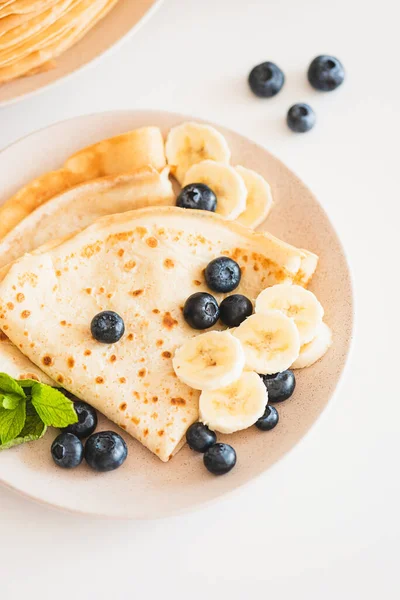French Crepes Banana Blueberries White Table Top View — стоковое фото