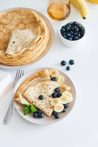 French Crepes Banana Blueberries White Table Copy Space — стоковое фото