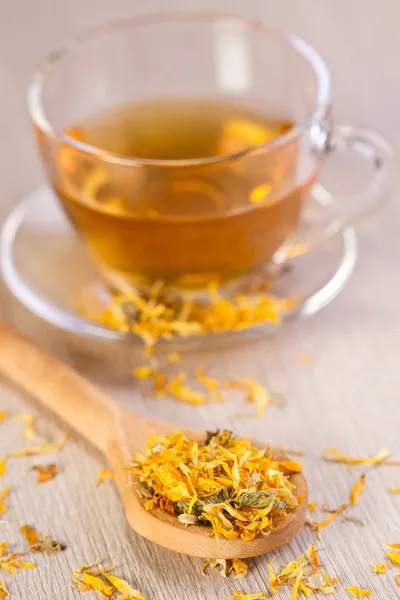 Spoon of dried marigold petals — Stock Photo, Image