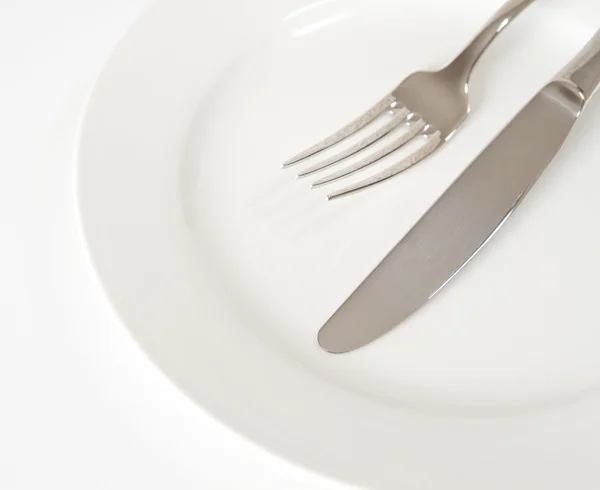 Cutlery on a plate — Stock Photo, Image