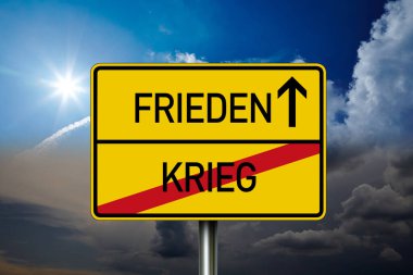 German road sign with the german words for Peace and War - Krieg und Frieden in front of blue and grey sky