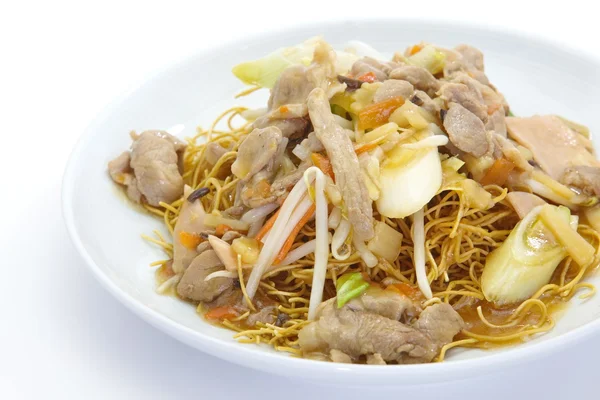 Deep fried yellow noodles with pork — Stock Photo, Image