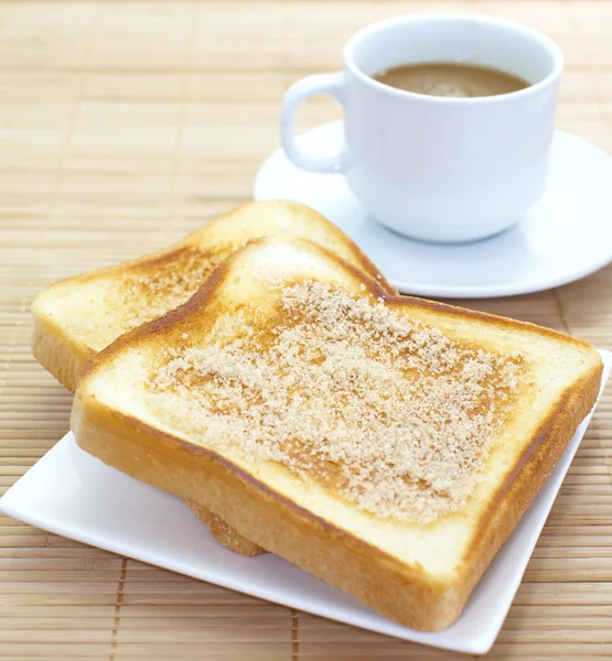 Slice of grilled bread and coffee — Stock Photo, Image