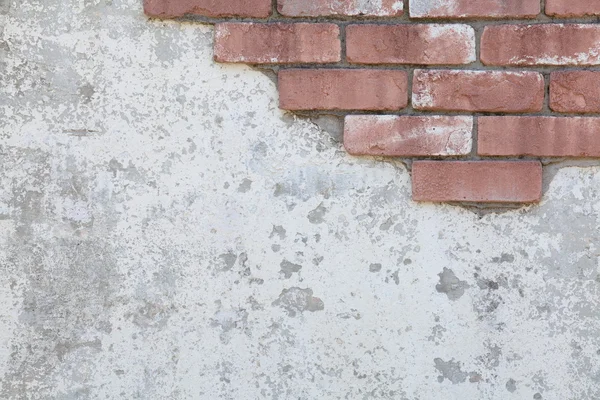 Поверхность из красного кирпича с цементом — стоковое фото