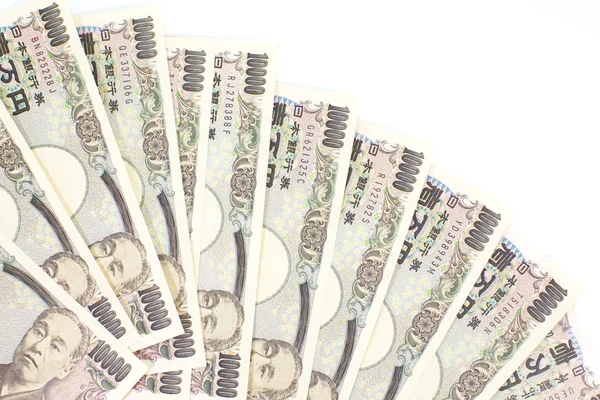 Крупный план японской валюты иена, банкноты и монеты — стоковое фото