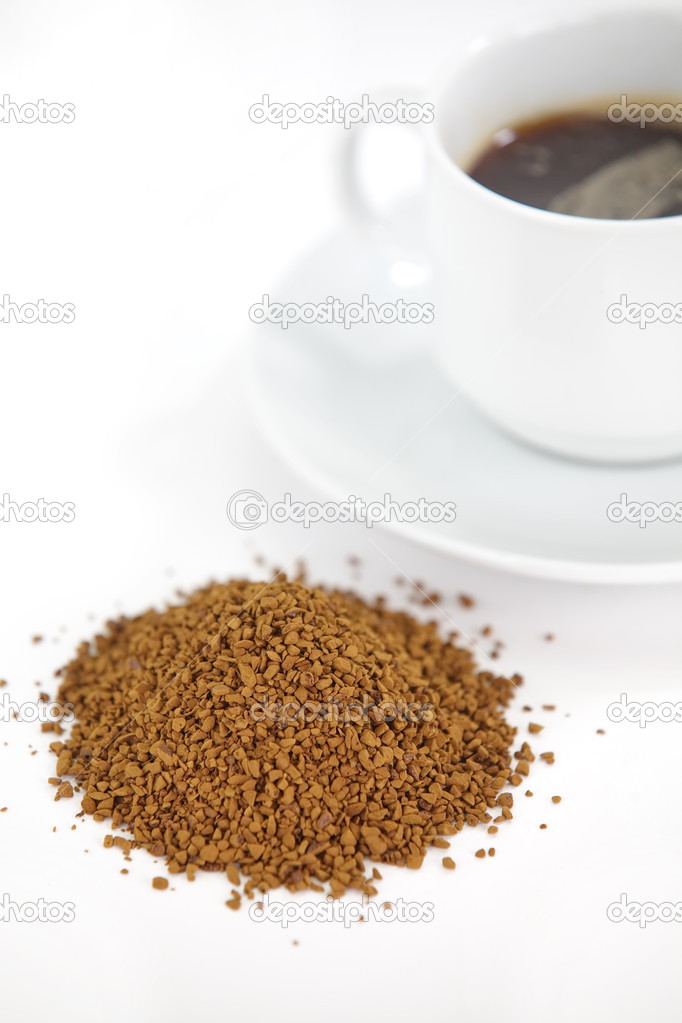 Cup with instant coffee isolated on white