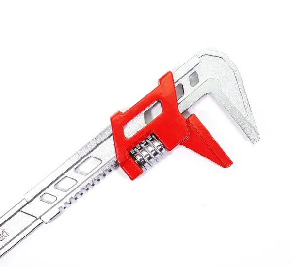 Adjustable spanner colored red for plumbing — Stock Photo, Image