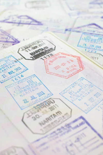Immigration arrival stamps on passport — Stock Photo, Image