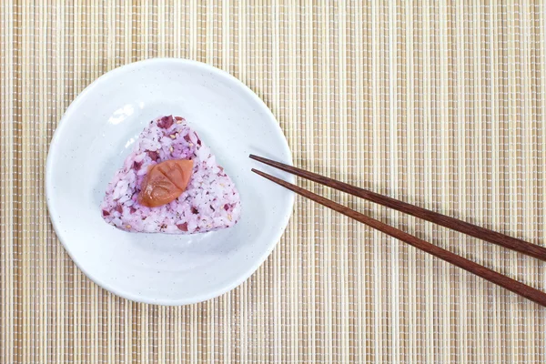 Japanese food Onigiri rice ball and eat with chopsticks — Stock Photo, Image