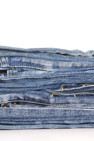 Lot of different blue jeans — Stock Photo, Image