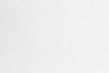 Eski tarz desenli ve arka planda pürüzsüz beyaz boyanmış beton duvar